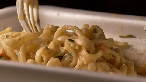 Appetizing noodles in a plastic container with a  fork, close-up, fast food Stock Footage 119593748