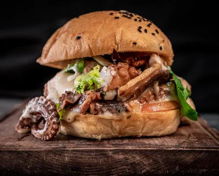Appetizing octopus and Jack cheese burger Stock Photos