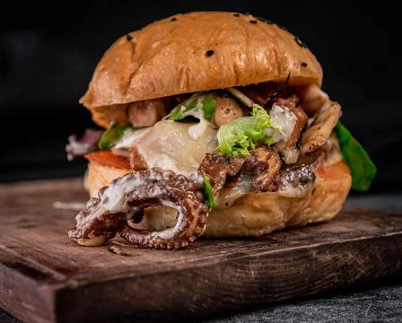 Appetizing octopus and Jack cheese burger Stock Photos