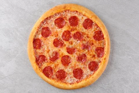 Appetizing Pepperoni Pizza, on a white background, isolate, for a food delivery Stock Photos