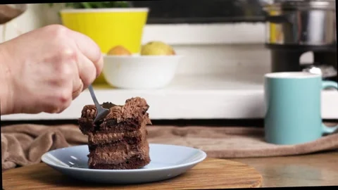 Appetizing piece of chocolate cake, brown cake for breakfast, lunch or dinner Stock Footage 222592705