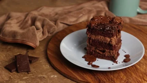 Appetizing piece of chocolate cake, brown cake for breakfast, lunch or dinner Stock Footage 222592732