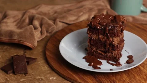 Appetizing piece of chocolate cake, brown cake for breakfast, lunch or dinner Stock Footage 222592819