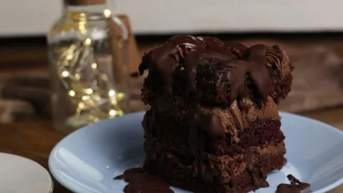 Appetizing piece of chocolate cake, brown cake for breakfast, lunch or dinner Stock Footage 222592919