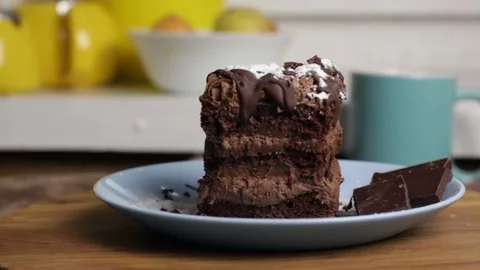 Appetizing piece of chocolate cake, brown cake for breakfast, lunch or dinner Stock Footage 222592952
