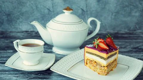 Appetizing a piece of mousse cake decorated with strawberries, blueberries an Stock Photos