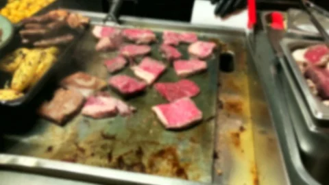 Appetizing pieces of fried beef meat on a large baking sheet Stock Footage 128219989