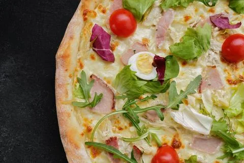 Appetizing Pizza Caesar, with meat, eggs, tomatoes and herbs Stock Photos