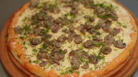 Appetizing pizza with champignon mushrooms. Stock Footage 244484239
