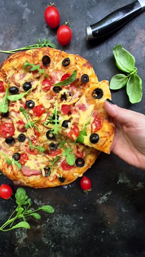 Appetizing pizza with ham, tomatoes and cheese close-up. Stock Footage 310105021