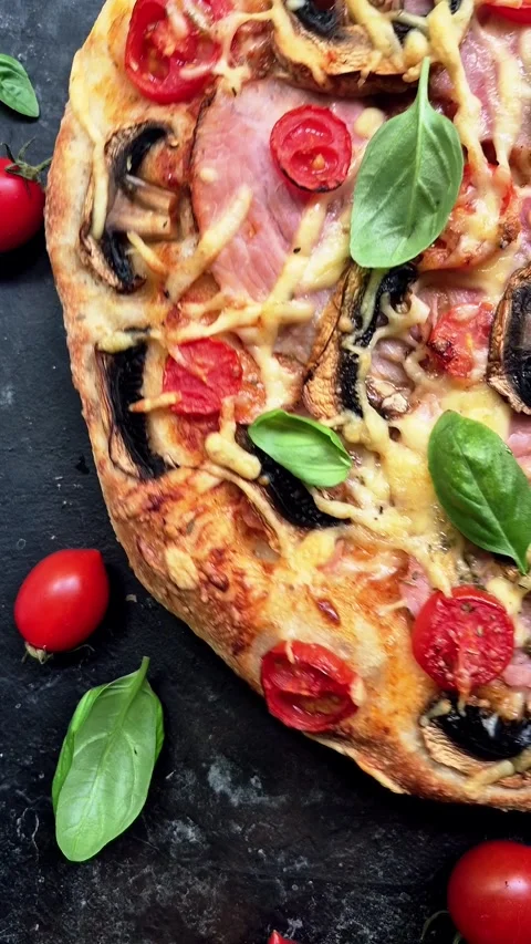 Appetizing pizza with ham, tomatoes Video stock 310104690