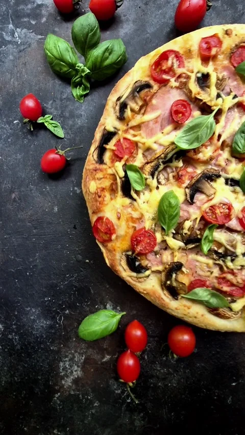 Appetizing pizza with ham, tomatoes Stock Footage 310104693