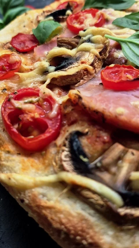 Appetizing pizza with ham, tomatoes Stock Footage 310104760