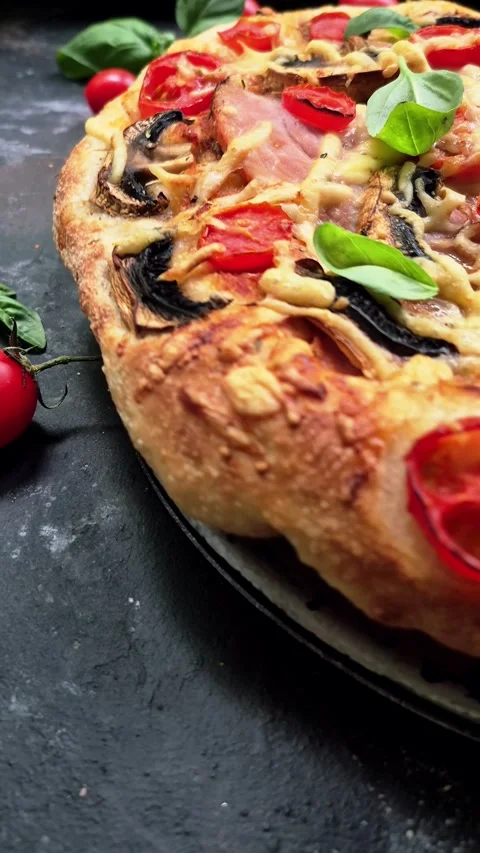 Appetizing pizza with ham, tomatoes Stock Footage 310104777