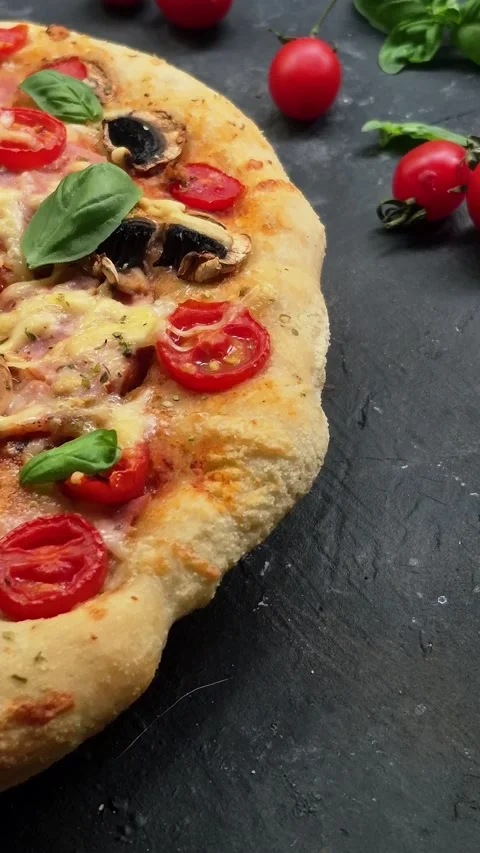 Appetizing pizza with ham, tomatoes Stock Footage 310104830