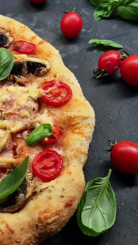 Appetizing pizza with ham, tomatoes Stock Footage 310104875