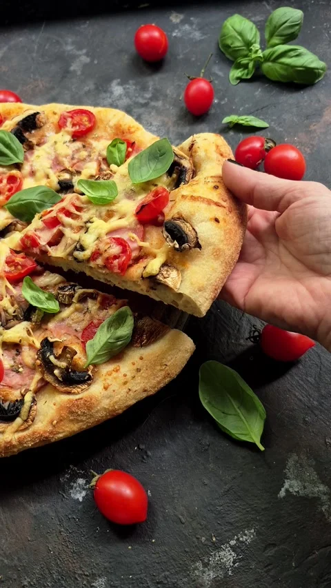 Appetizing pizza with ham, tomatoes Stock Footage 310104917