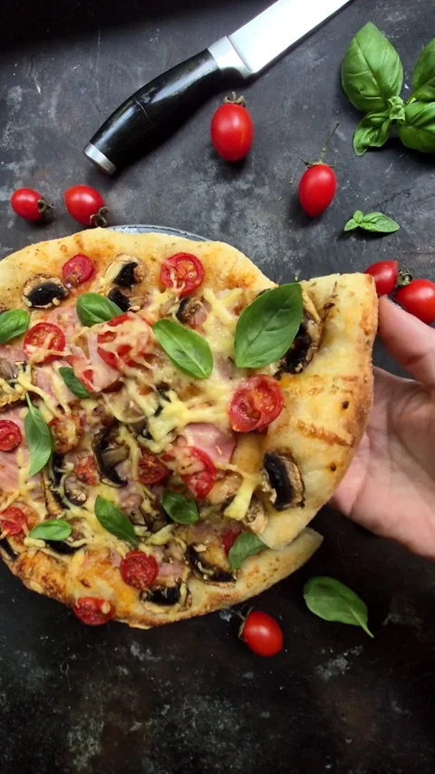 Appetizing pizza with ham, tomatoes Stock Footage 310104943