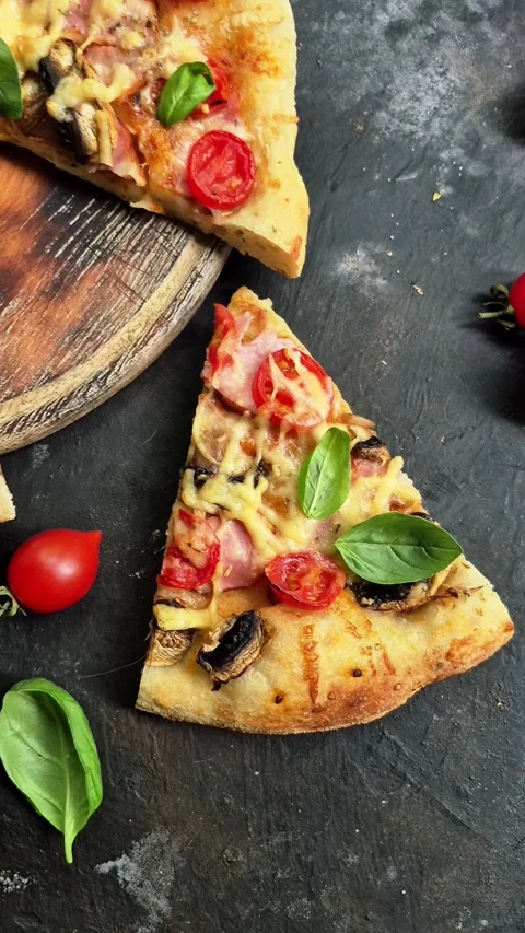 Appetizing pizza with ham, tomatoes Stock Footage 310104947