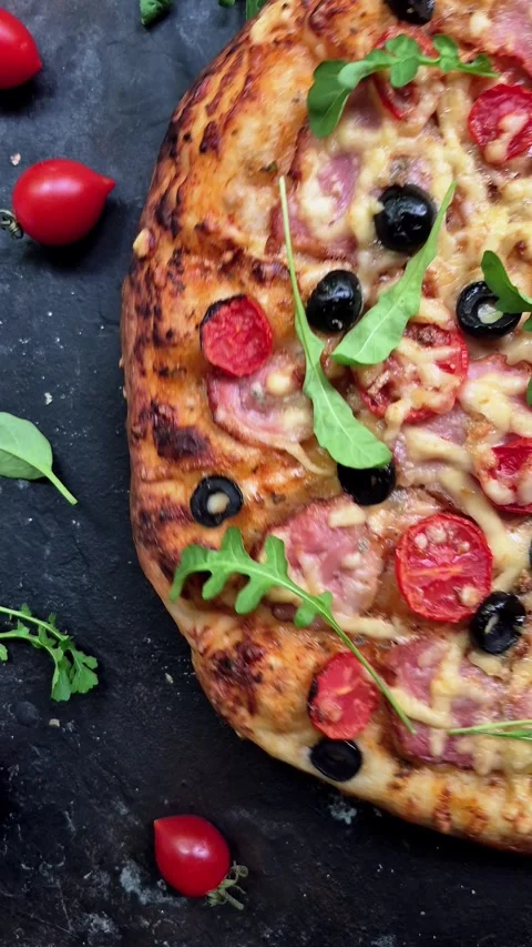 Appetizing pizza with ham, tomatoes Stock Footage 310105003