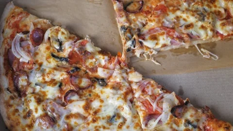 Appetizing pizza lies in a box, a few pieces of pizza are missing. Video stock 203894028