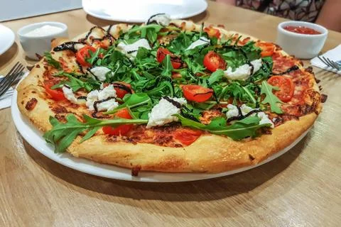 Appetizing pizza in the restaurant Stock Photos