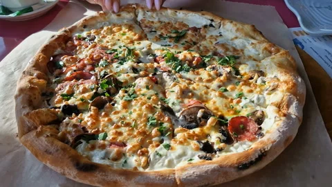 Appetizing pizza on a table in a cafe. Stock Footage 240921669