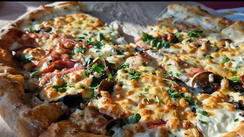 Appetizing pizza on a table in a cafe. Stock Footage 240922786