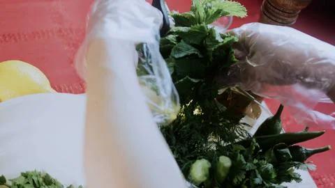 Appetizing preparation close-up: cutting green peppers for the paste Stock Photos