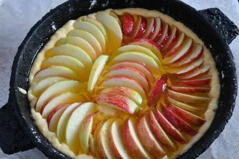 Appetizing raw apple pie with a honey. Cloze ap Stock Photos