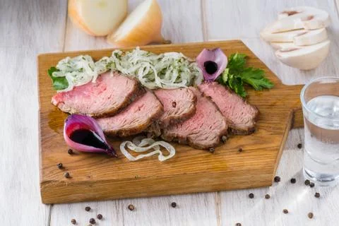 Appetizing roast beef on a light table Stock-Fotos