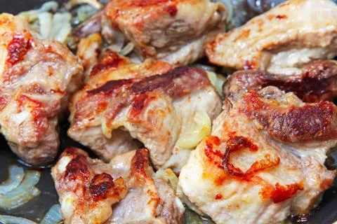 Appetizing roasted pork meat. Stock Photos