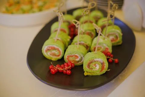 Appetizing rolls with red fish on a plate Stock Photos