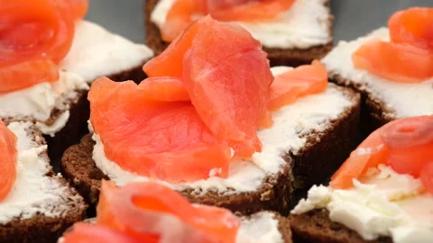 Appetizing Salmon and soft Cheese on Fresh Bread, rotating Stock Footage 134345194