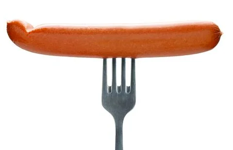 Appetizing sausage on a fork, isolated Stock Photos
