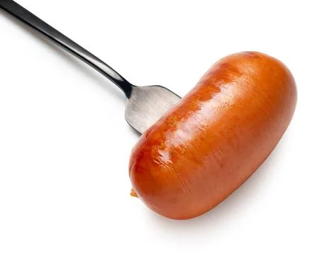 Appetizing sausage on a fork, isolated 스톡 사진