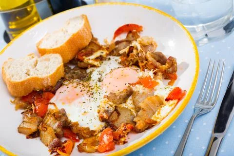 Appetizing scrambled eggs with brisket Stock Photos