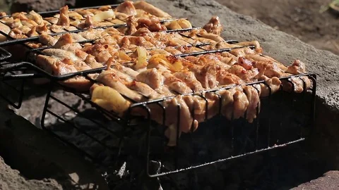 Appetizing shish kebab is cooked at the stake. Stock Footage 76232289