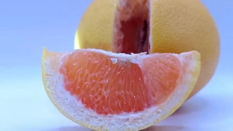 An appetizing slice of juicy grapefruit 스톡 동영상 331746490