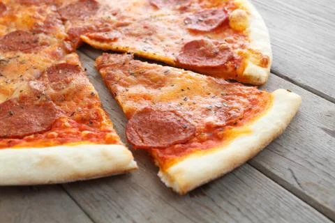 Appetizing slice of pizza Stock Photos