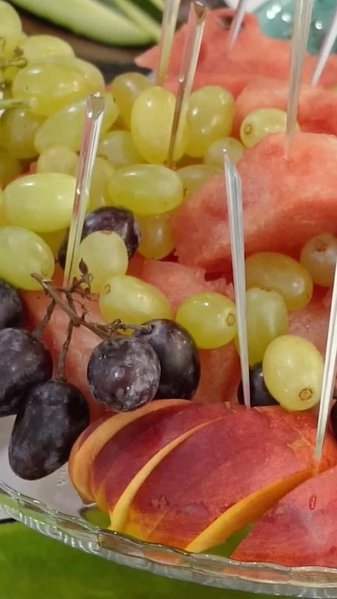 Appetizing slices of cheese and meat with fruit on a festive banquet table Video stock 300961074
