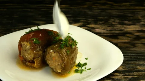 Appetizing stewed bell peppers stuffed with minced rice and pork or beef. Stock Footage 131734829