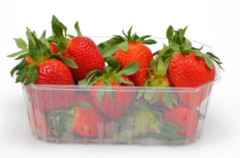 Appetizing strawberries in a box close-up on a white background isolated Stock Photos