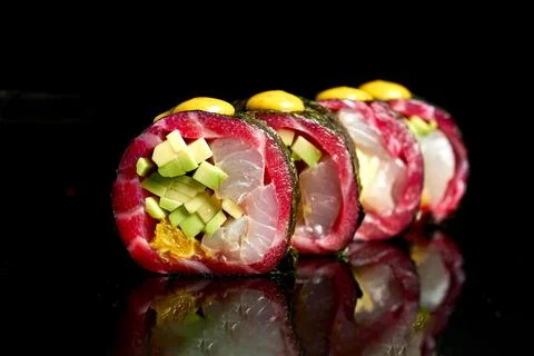 Appetizing sushi with different types of fish: gravlax salmon, tuna and avoca Stock-Fotos