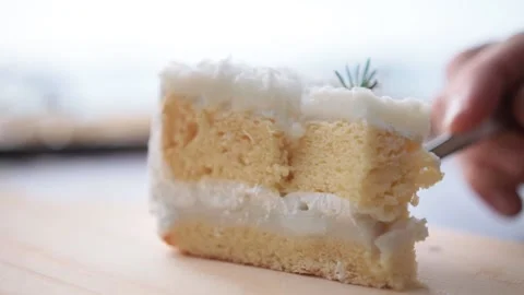 Appetizing sweet piece of cake on a plate is eaten with a fork. selective focus Stock-Footage 233578036