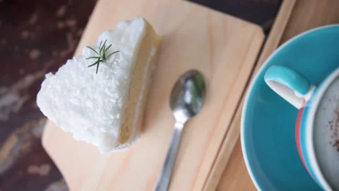 Appetizing sweet piece of cake on a plate is eaten with a fork and drinks Stock Footage 233578411