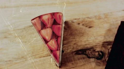 Appetizing sweet serving view: showing a strawberry jelly cake slice Stock Photos