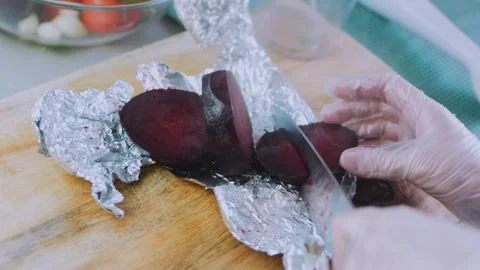 Appetizing tabletop moment: kneading vivid red beet dough Stock Footage 342173425