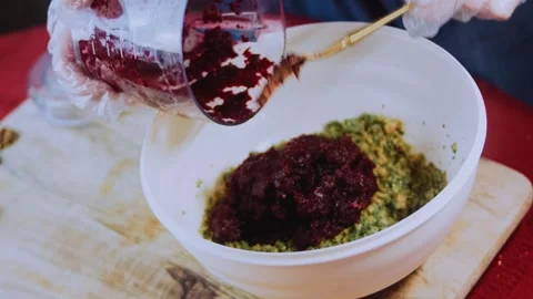 Appetizing traditional recipe view: shaping beet pkhali by hand Stock Footage 342200217