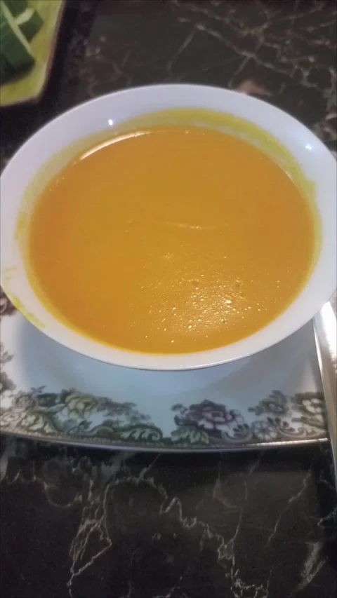 Appetizing Yellow Cream Soup on Restaurant Table Stock Footage 337913464